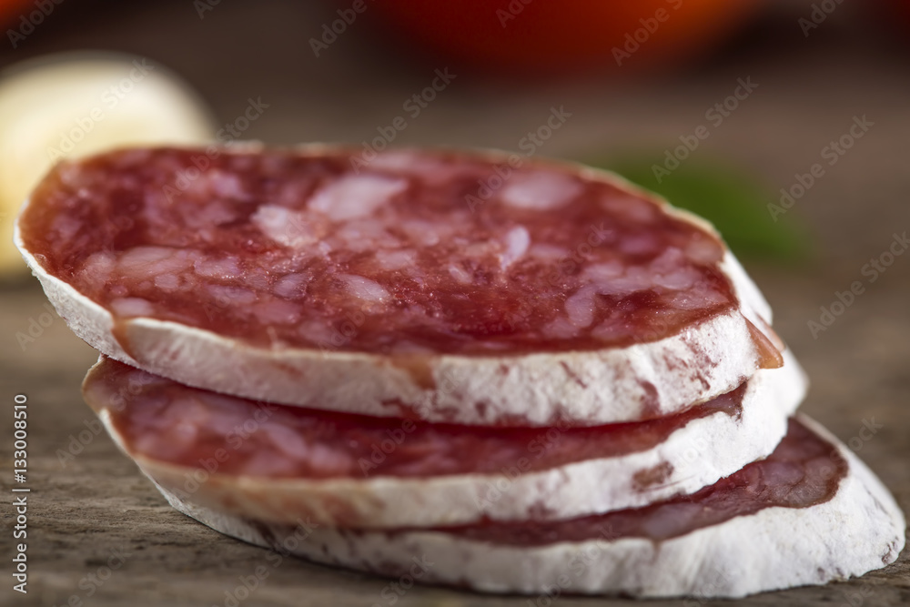 Close up of three italian salami slices