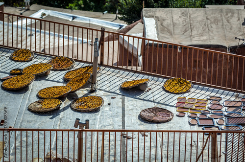 Baskets of fruits left on the roof for drying in Abyaneh village in Iran photo