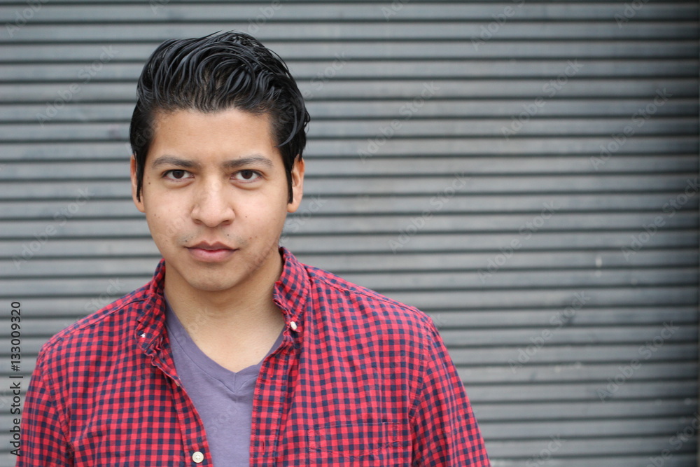 Good looking Hispanic male isolated with copy space Good looking Hispanic male isolated with copy space