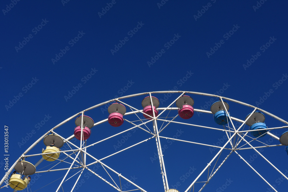 A Ferris wheel in a blue sky A Ferris wheel in a blue sky
