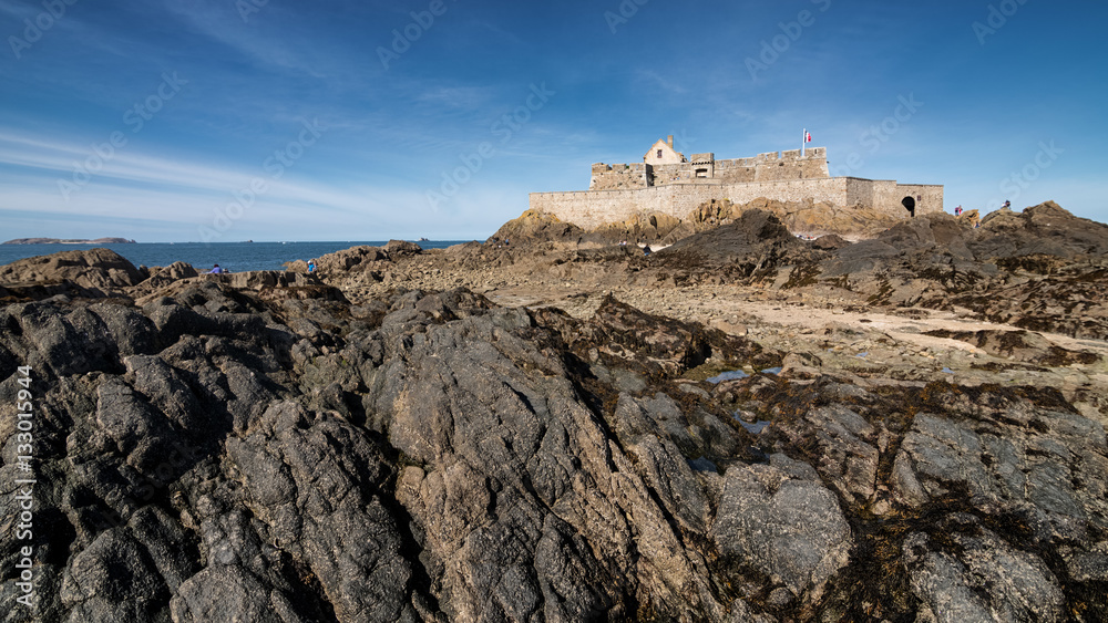 Rocks and fort national building in Saint-Malo, France