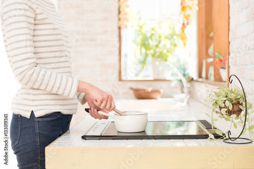 young asian woman in the kitchen photo