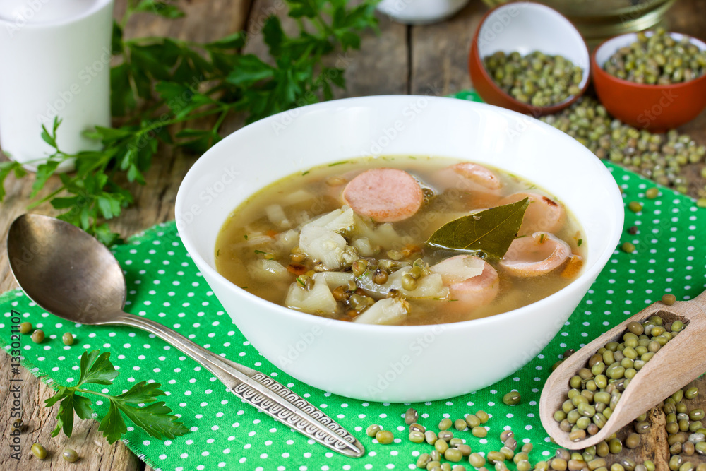 Mung bean soup with vegetables smoked pork ribs and sausages