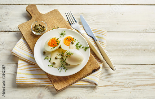 Fresh hard boiled eggs with mustard sauce photo