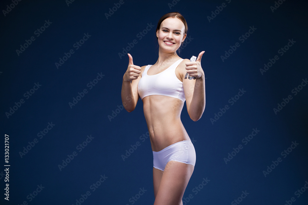Sexy woman in white fitness clothing