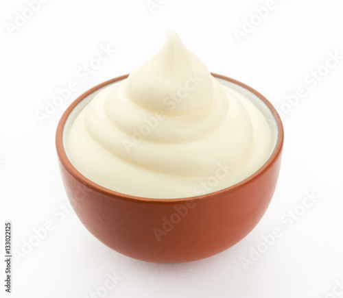 Mayonnaise in bowl isolated on white background photo