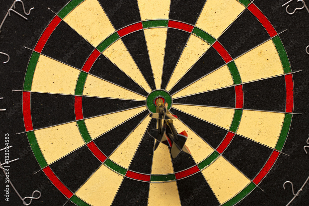 Dart arrows hitting in the target center Dart arrows hitting in the target center