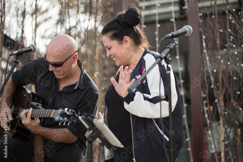 Music Duo Performing at an Outdoor Venue