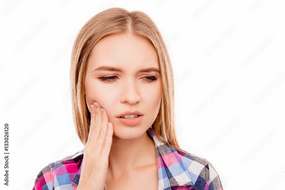 Sad ill woman having toothache and touching cheek Sad ill woman having toothache and touching cheek