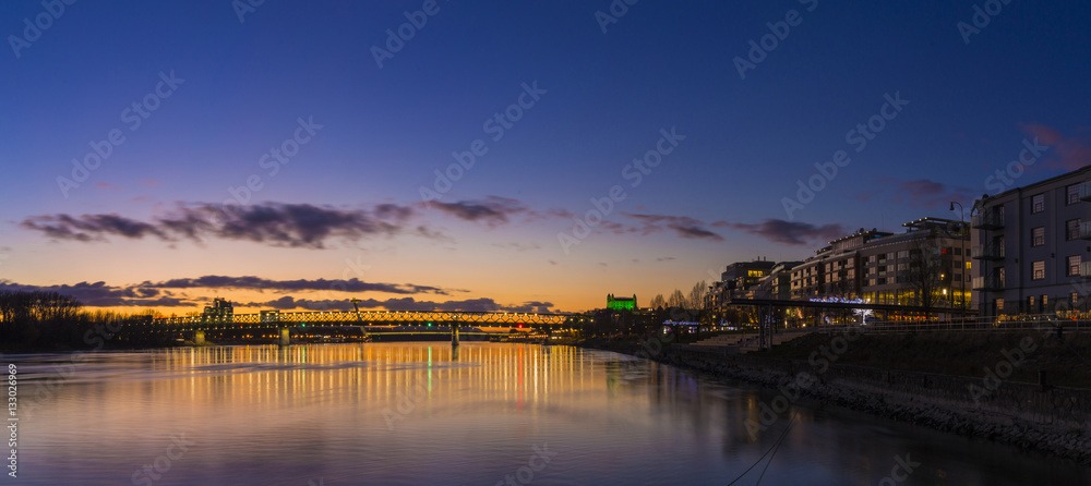 View from harbour at sunset, Bratislava castle, business buildin
