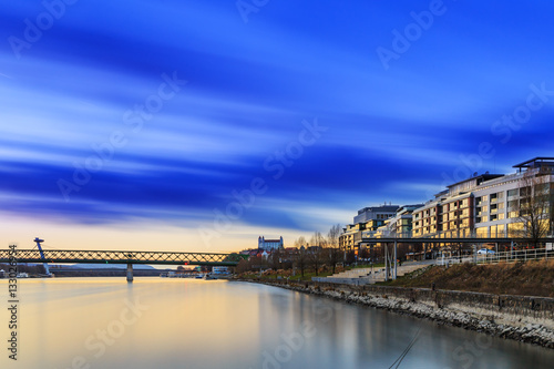 View from harbour at sunset, Bratislava castle, business buildin