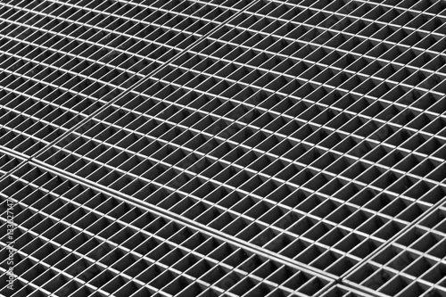 Iron gutter grates and metal vent grids as black and white indus