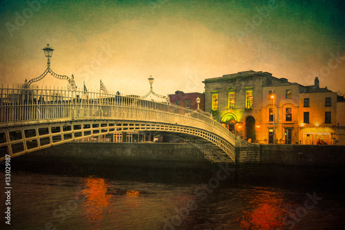 Fotografie Vintage textured image of Dublin Ireland at Ha'penny bridge over the River Liffe