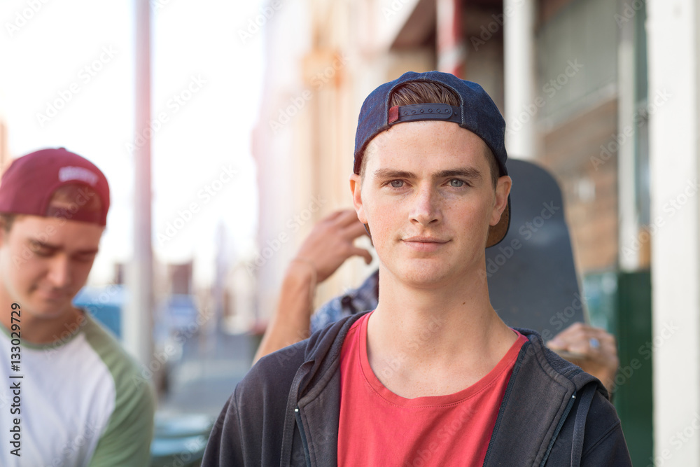 Guys skateboarders in street Guys skateboarders in street