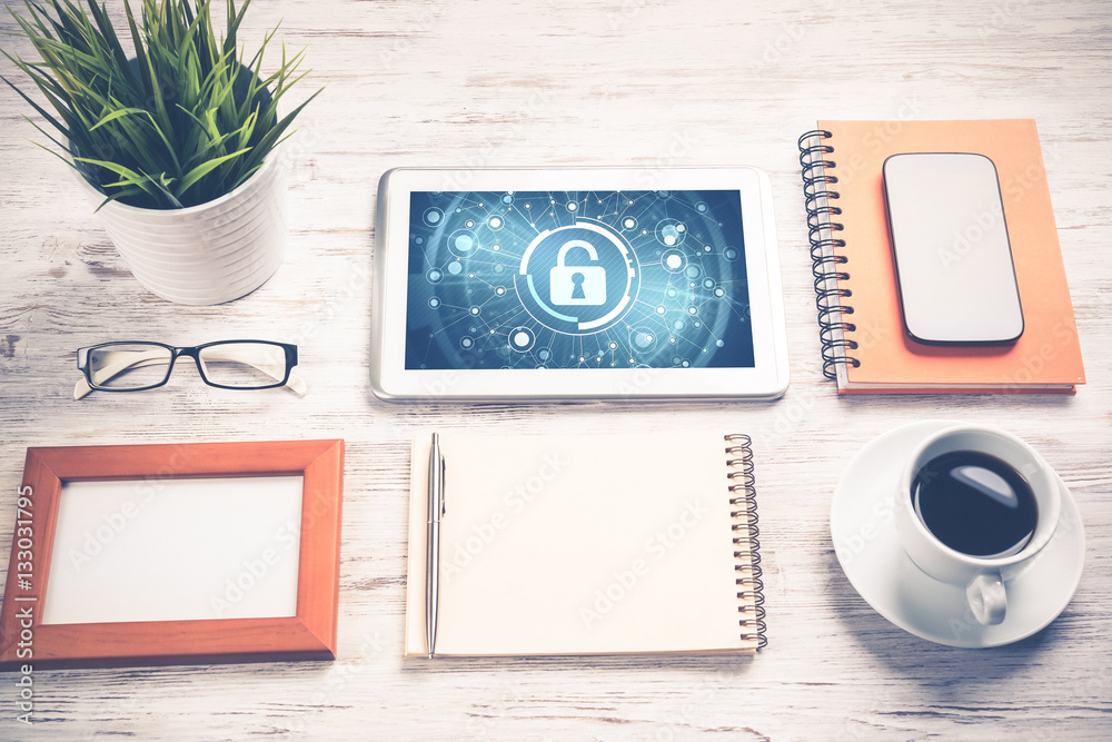 Web security and technology concept with tablet pc on wooden tab Web security and technology concept with tablet pc on wooden tab