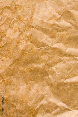 Crumpled brown paper textured background 