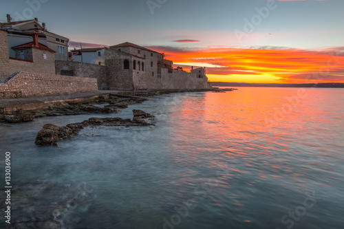 Morning by the sea by the city wall in Novigrad, Croatia photo