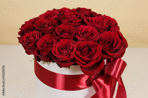 Rich gift bouquet of 21 red roses. Composition of flowers in a w