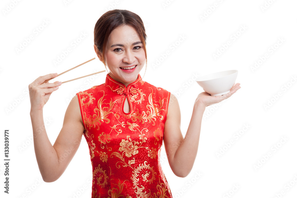 Asian girl in chinese cheongsam dress with chopsticks. Asian girl in chinese cheongsam dress with chopsticks.