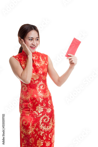 Asian girl in chinese cheongsam dress with red envelope.