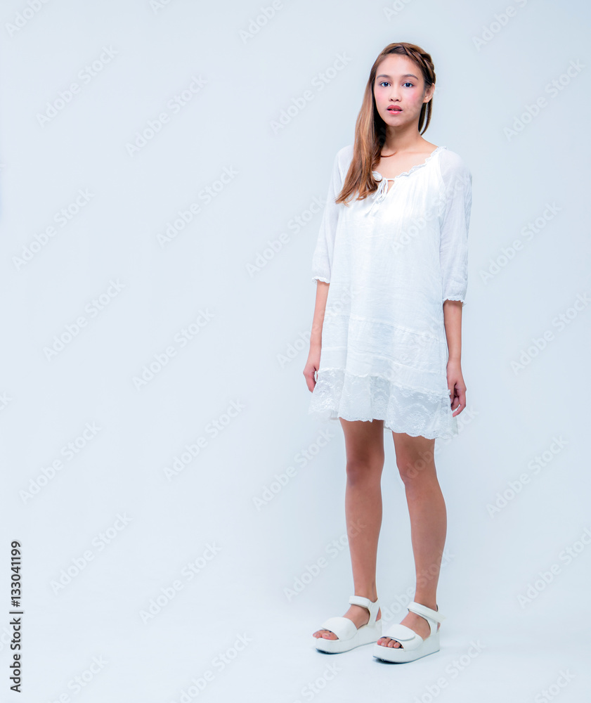 whole body picture of beautiful girl wearing white dress, half latina and half asian whole body picture of beautiful girl wearing white dress, half latina and half asian