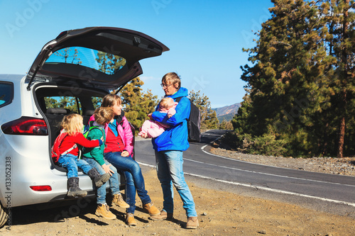 happy family with tree kids travel by car on road © nadezhda1906