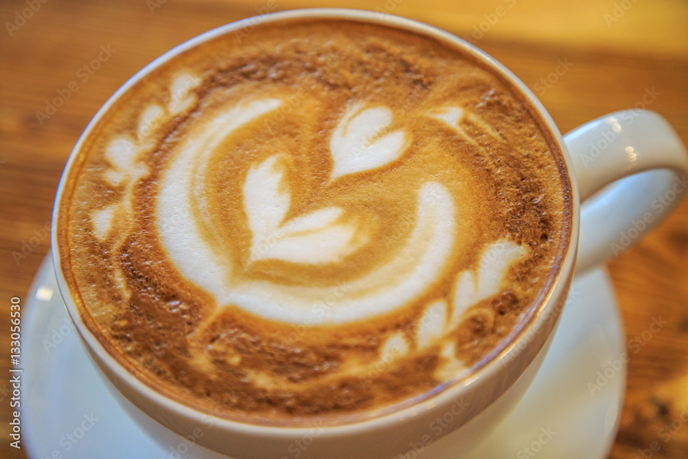 Big cup of cappuccino on a wooden background Big cup of cappuccino on a wooden background