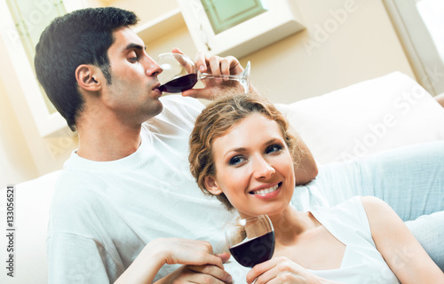 couple celebrating with redwine