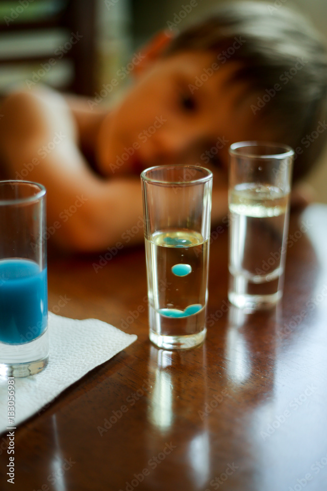 Dad with a child experimenting with vegetable oil