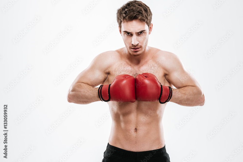Attractive man boxer over white background