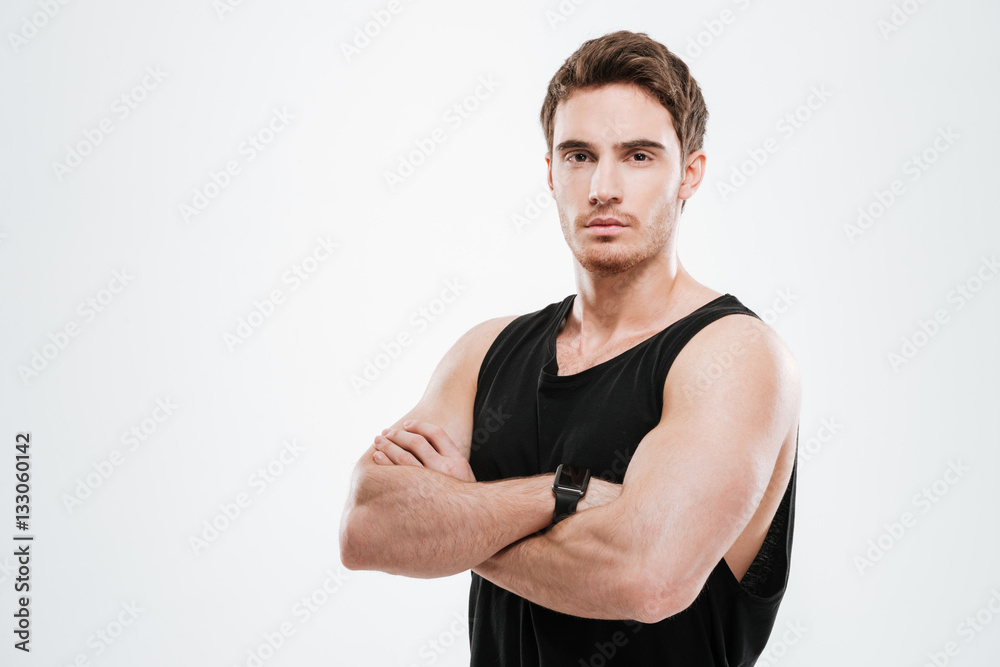 Handsome young man over white background with arms crossed Handsome young man over white background with arms crossed