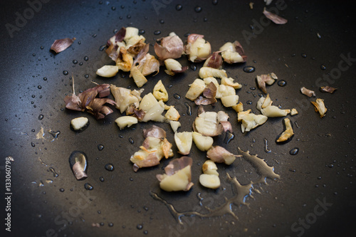 Fried garlic in frying Teflon pan