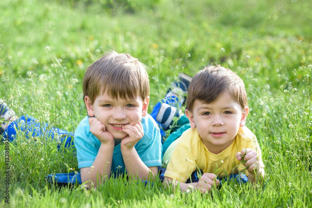 Happy kid enjoying sunny late summer and autumn day in nature on green grass. Happy kid enjoying sunny late summer and autumn day in nature on green grass.