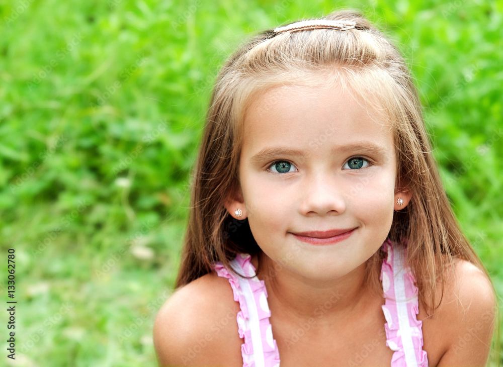 Portrait of adorable smiling little girl in summer day Portrait of adorable smiling little girl in summer day