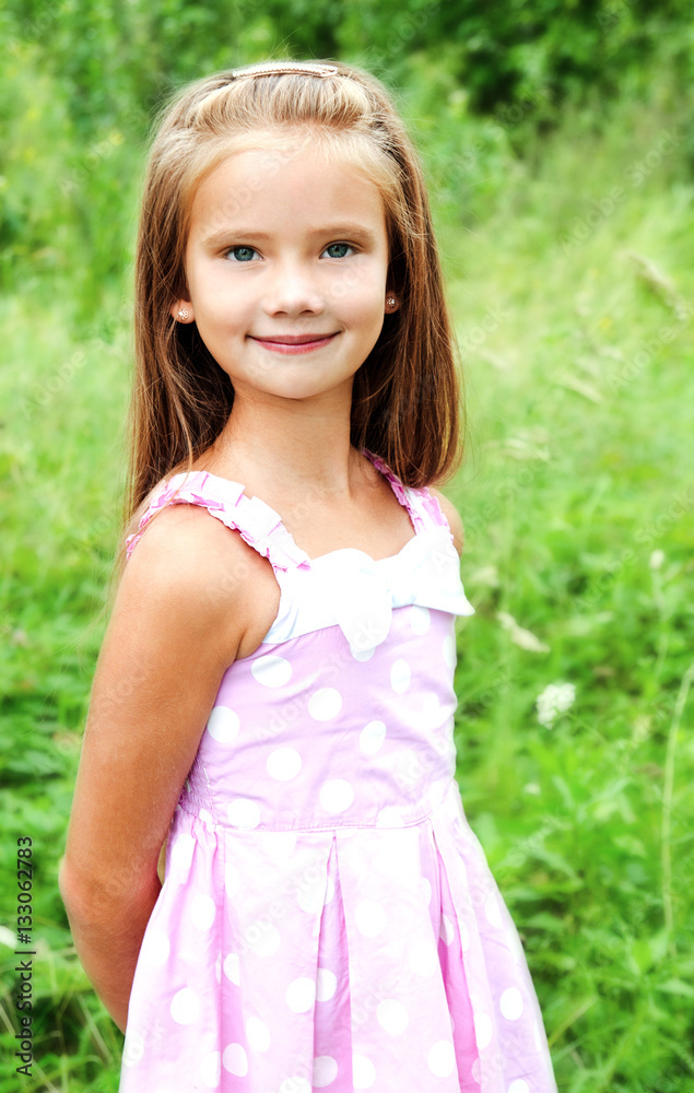 Portrait of adorable smiling little girl in summer day Portrait of adorable smiling little girl in summer day