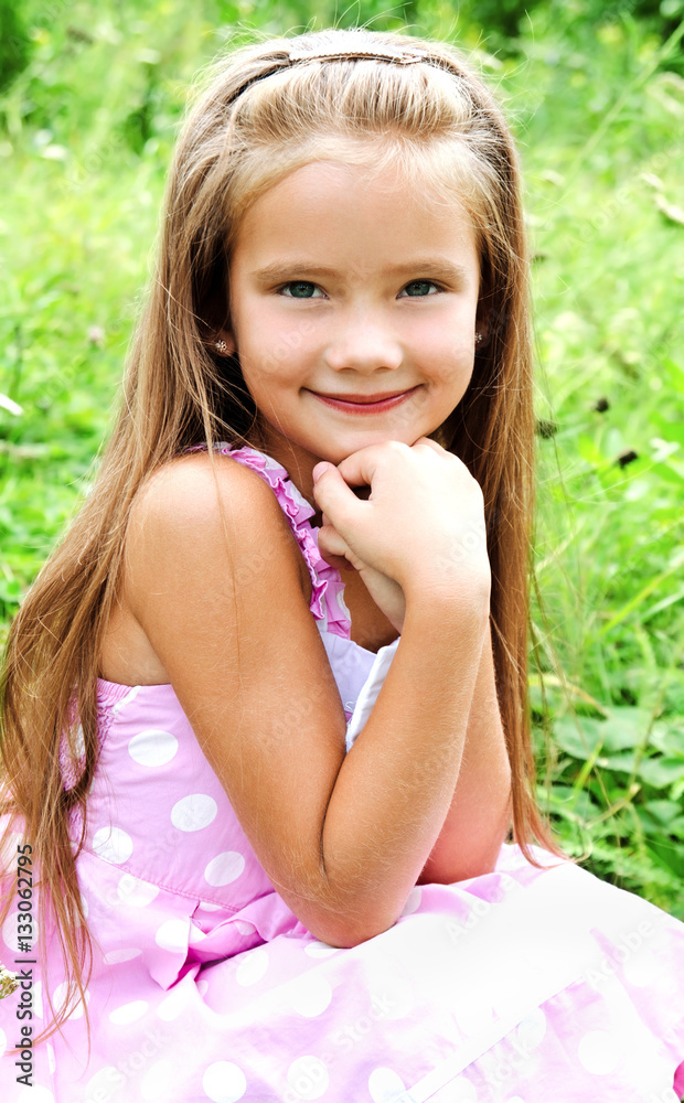 Portrait of adorable smiling little girl in summer day Portrait of adorable smiling little girl in summer day