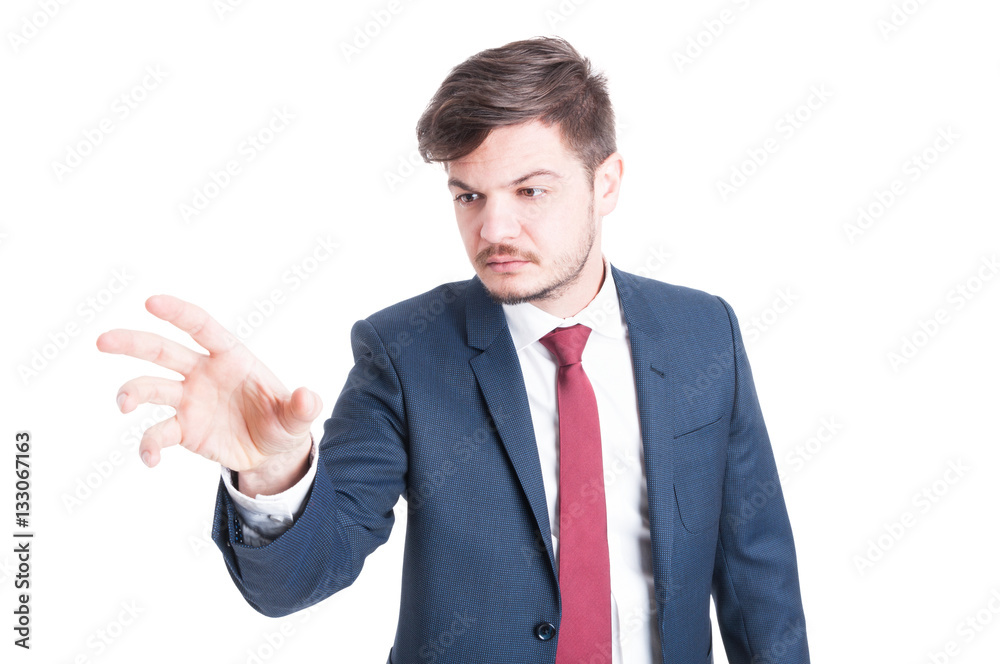 Business man standing and grabbing something Business man standing and grabbing something