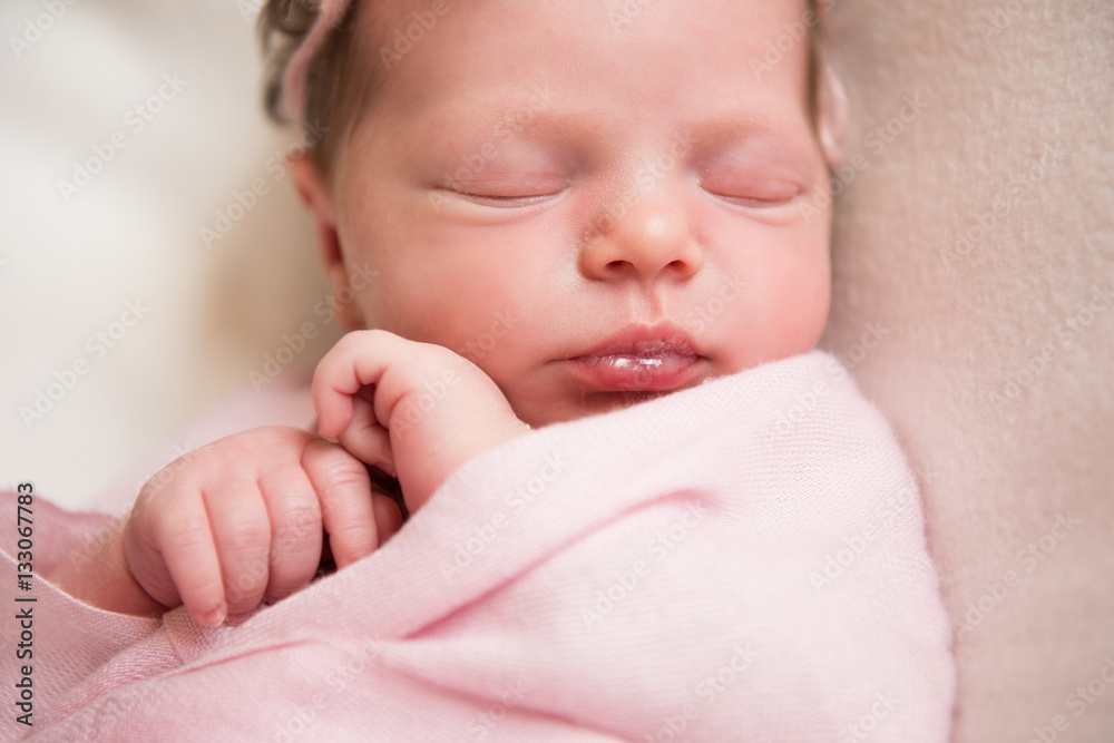 Newborn baby girl asleep on a blanket. Close-up Newborn baby girl asleep on a blanket. Close-up