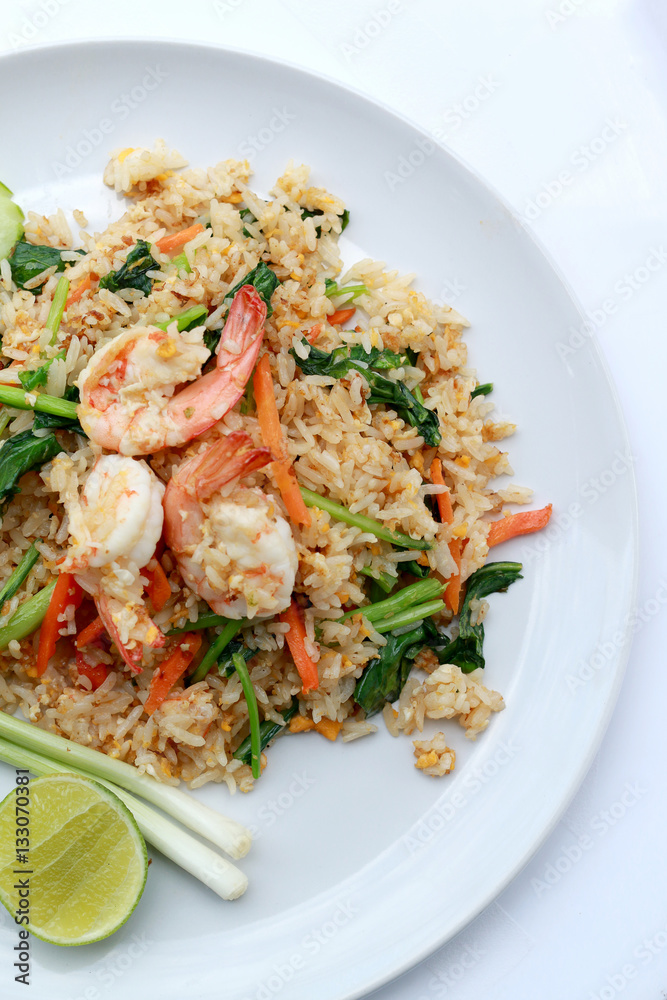 Delicious Shrimp fried rice. Unique style in the white dish on white background, Thai food. Delicious Shrimp fried rice. Unique style in the white dish on white background, Thai food.