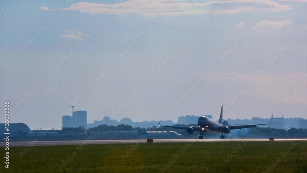 Aircraft on the background of urban landscapes in the city of Omsk airport in Siberia in the summer Aircraft on the background of urban landscapes in the city of Omsk airport in Siberia in the summer