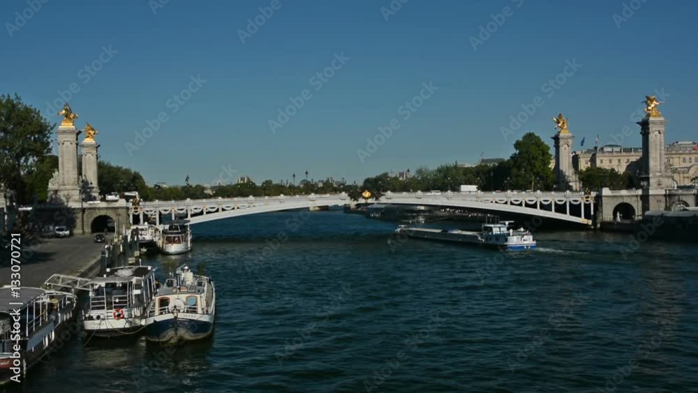 Tourist boat sails under the Alexander III bridge Tourist boat sails under the Alexander III bridge