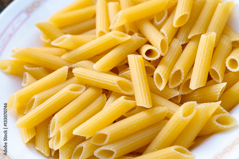 Penne pasta on a dish. Penne pasta on a dish.