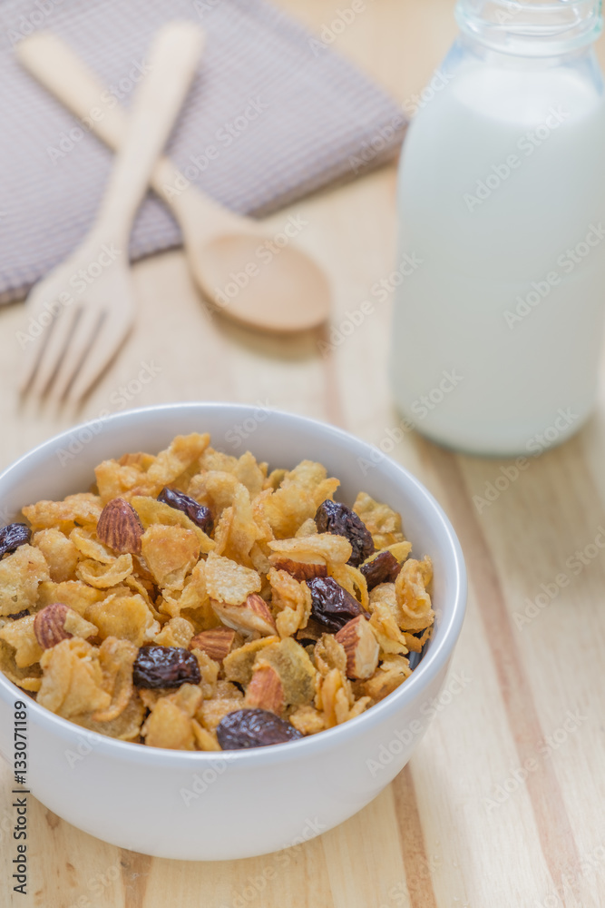 Corn flakes nutrition cereal and milk on wooden surface for healthy breakfast Corn flakes nutrition cereal and milk on wooden surface for healthy breakfast
