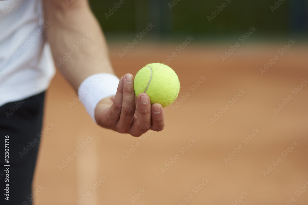 Player is holding a tennis ball.