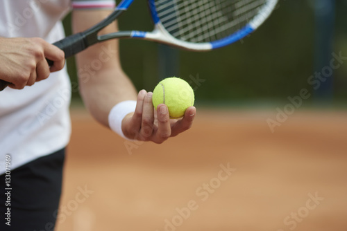 Tennis player is trying to hit the score