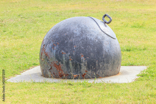 Old metal anchor decorated in Curran street park near the harbor photo