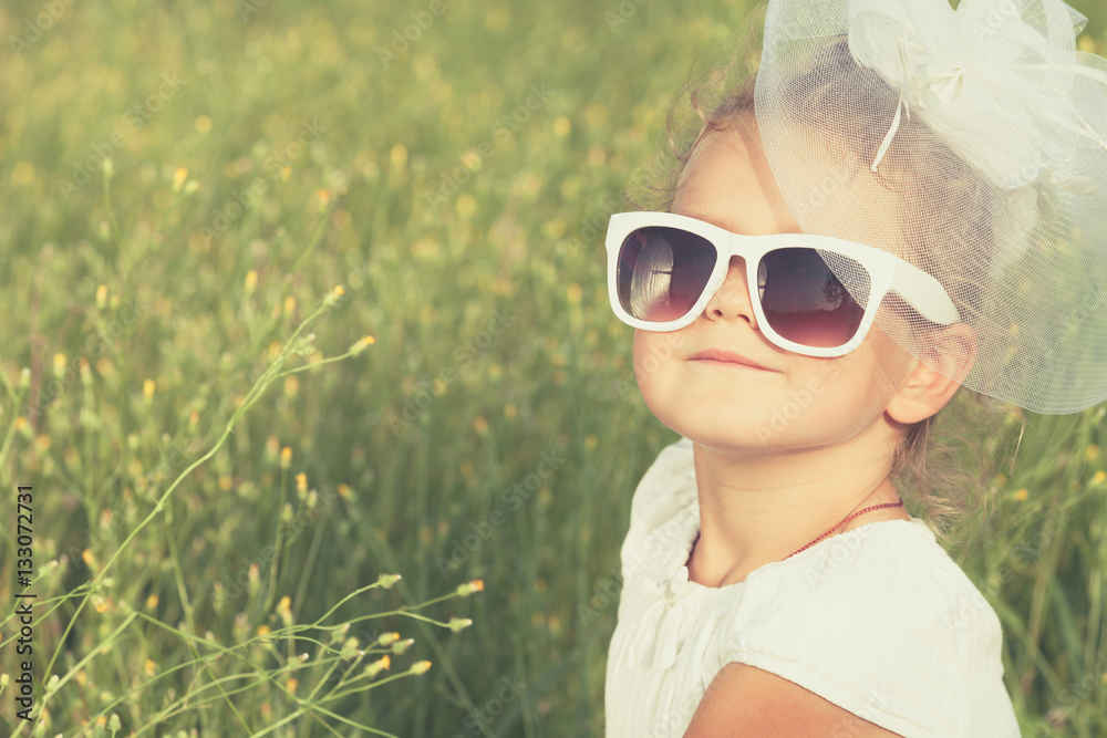 Happy little girl playing in park. Happy little girl playing in park.