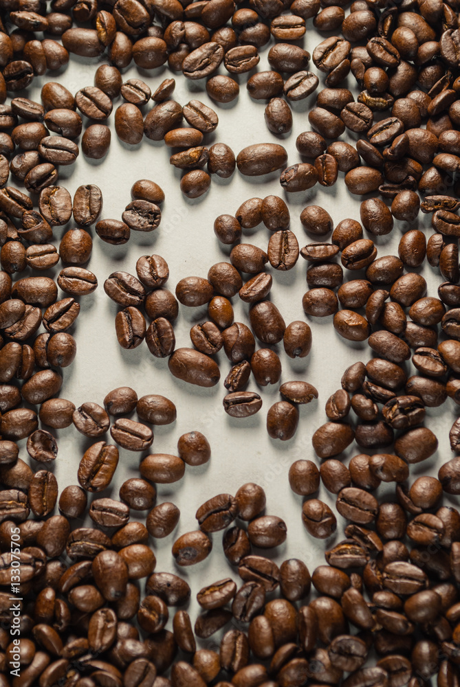 Coffebeans on Neutral Gray Background. Dark Roast Coffee. Coffebeans on Neutral Gray Background. Dark Roast Coffee.