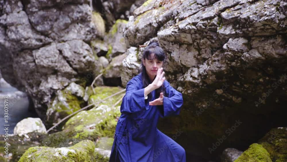 Woman exercise asian martial arts figure of dragon form outside 4K
Woman exercise asian martial arts figure of dragon form outside 4K