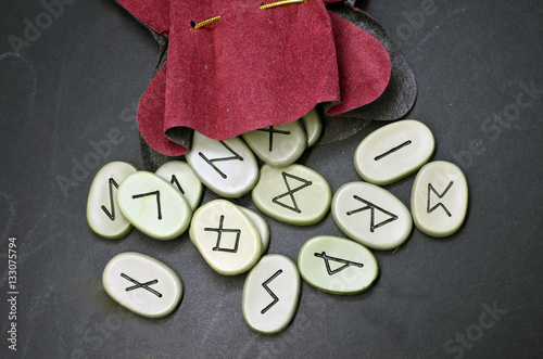 runes on the black wooden Board